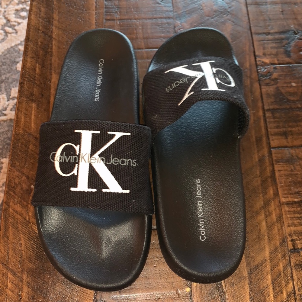 Mint condition Calvin Klein black slides